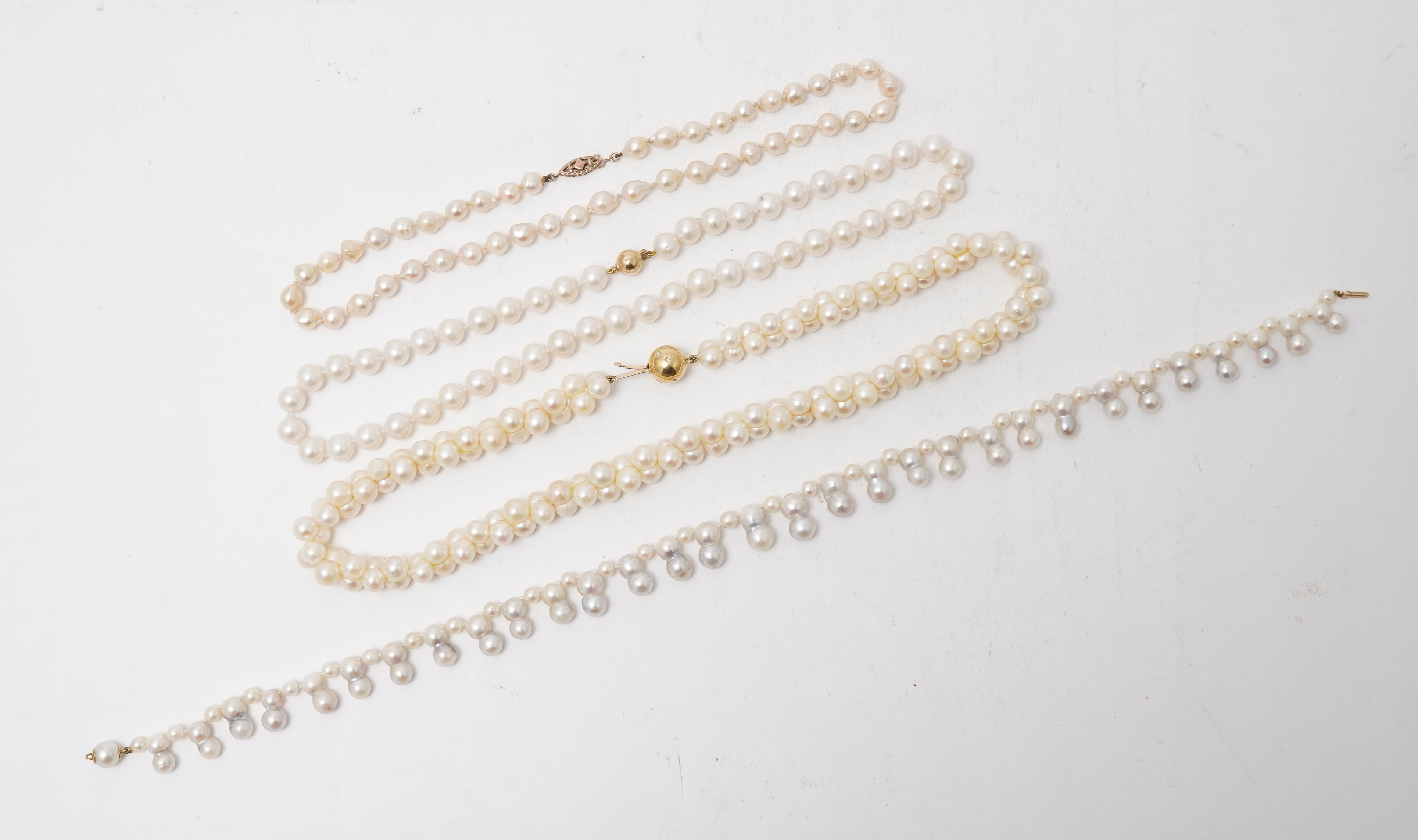 A collection of four cultured pearl necklaces